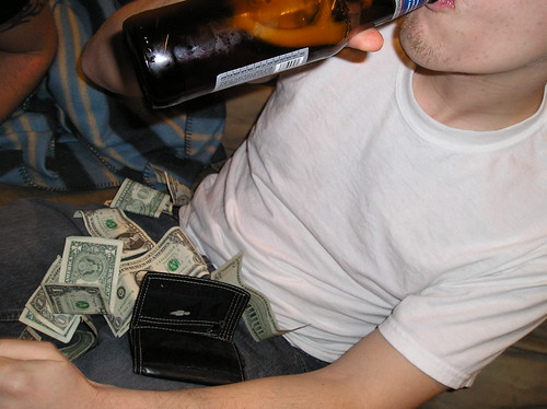 A drunken Fred has cash thrown at him