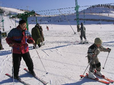 father and son skiing