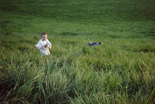 2 boys playing in the grass